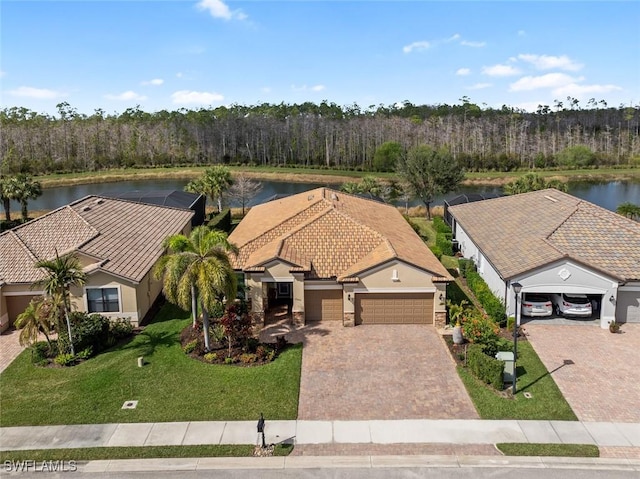 birds eye view of property with a water view