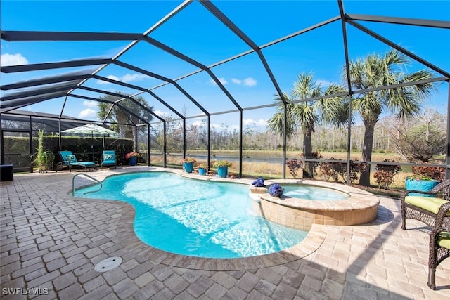 view of swimming pool with a lanai, a patio, and an in ground hot tub