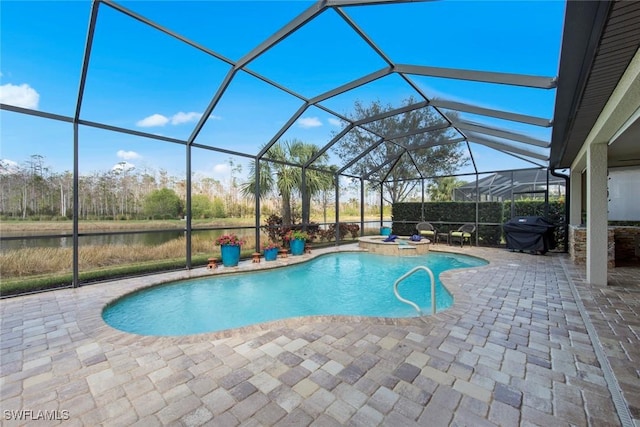 view of swimming pool with a patio, area for grilling, an in ground hot tub, a lanai, and a water view