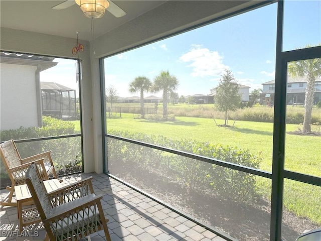 sunroom / solarium with ceiling fan