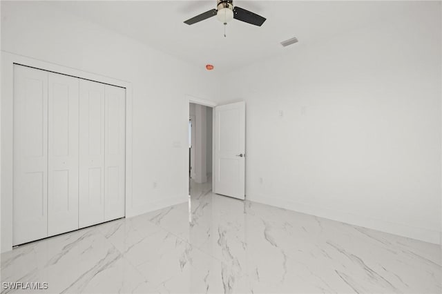 unfurnished bedroom featuring a closet and ceiling fan