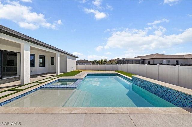 view of pool with a patio area, a fenced backyard, and a pool with connected hot tub