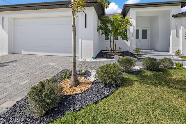 view of side of property featuring a yard and a garage