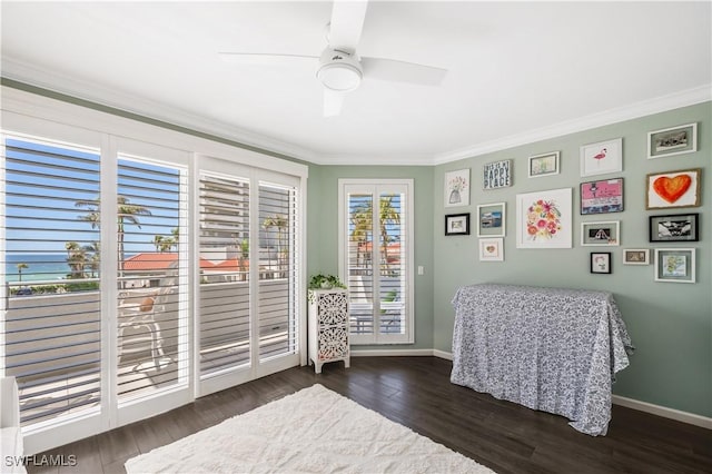 bedroom with crown molding, access to outside, dark hardwood / wood-style floors, and ceiling fan