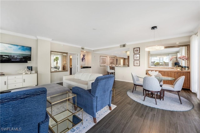 living room with crown molding and dark hardwood / wood-style floors