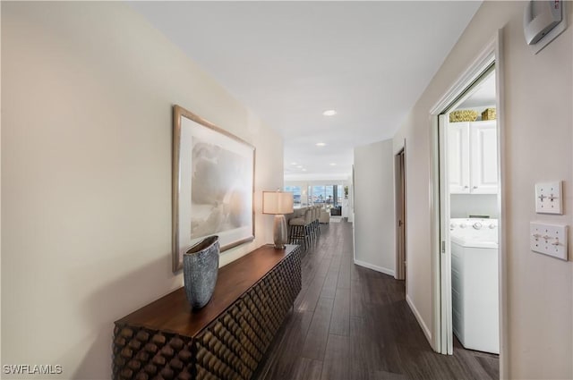 corridor featuring dark wood-type flooring and washer / clothes dryer