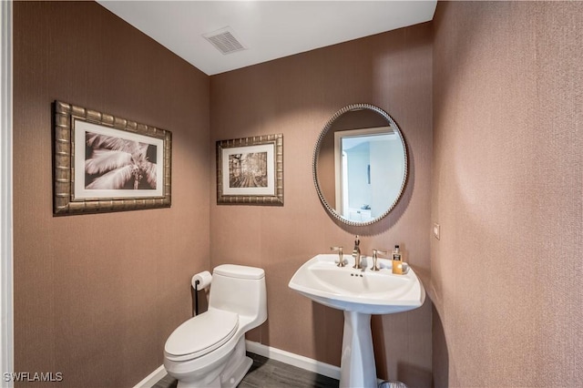 bathroom featuring sink and toilet