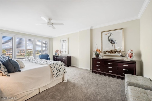 carpeted bedroom with ornamental molding and ceiling fan