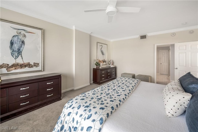 bedroom featuring crown molding, light carpet, and ceiling fan