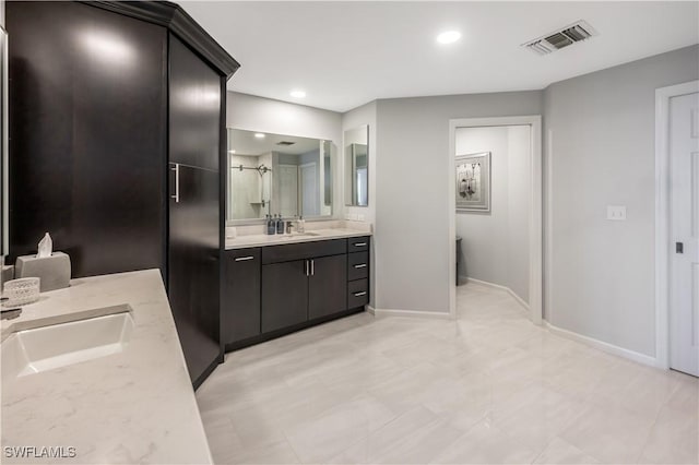 bathroom featuring vanity and a shower