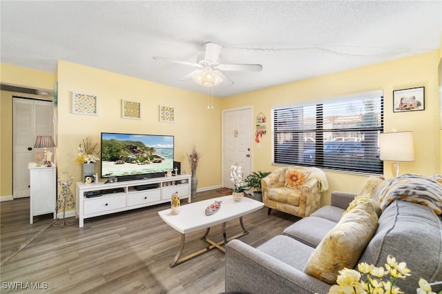 4363 27th Ct SW Unit 2-103, Naples, FL 34116 - living area with wood finished floors and ceiling fan