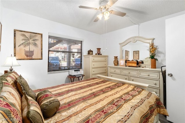 bedroom featuring a textured ceiling and ceiling fan