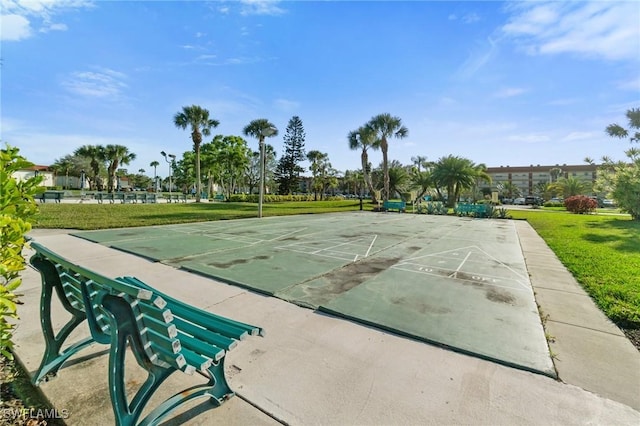 surrounding community with shuffleboard and a yard