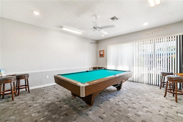 recreation room with visible vents, a textured ceiling, carpet floors, pool table, and ceiling fan