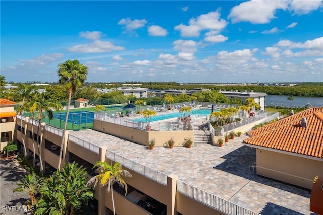 view of pool featuring a water view