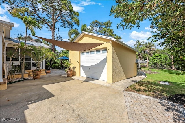 garage featuring driveway