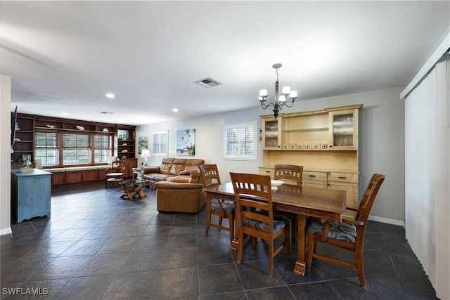 dining room with a chandelier, a wealth of natural light, visible vents, and recessed lighting