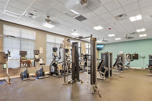 workout area with a paneled ceiling