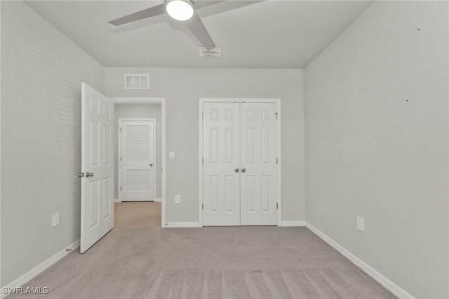 16031 Alcira Cir, Punta Gorda, FL 33955 - unfurnished bedroom featuring ceiling fan, carpet floors, baseboards, visible vents, and a closet