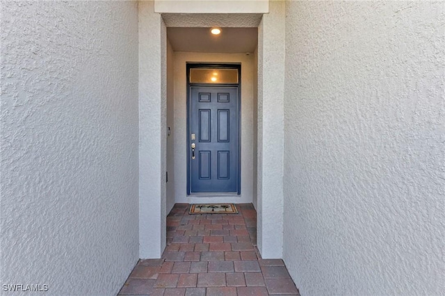 16031 Alcira Cir, Punta Gorda, FL 33955 - doorway to property with stucco siding