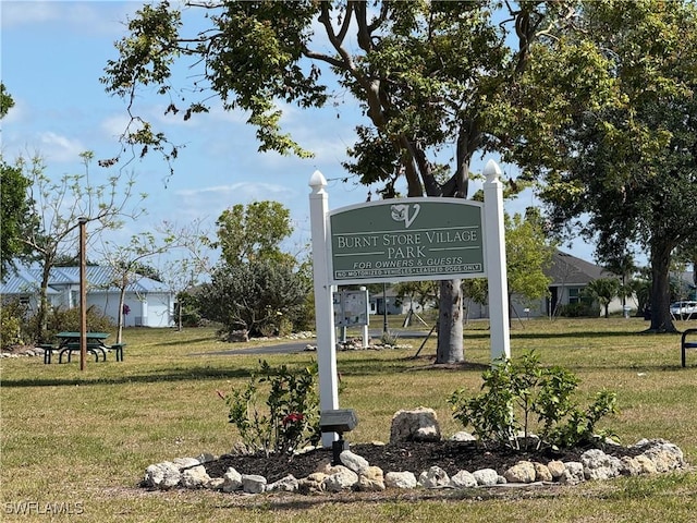 16031 Alcira Cir, Punta Gorda, FL 33955 - community / neighborhood sign featuring a lawn