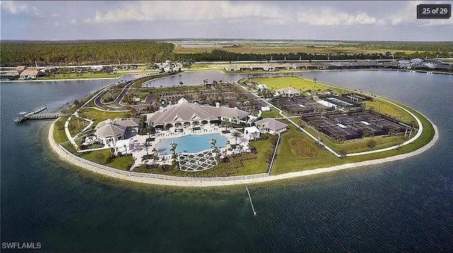 birds eye view of property with a water view