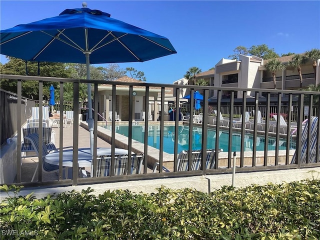 view of swimming pool with a patio area