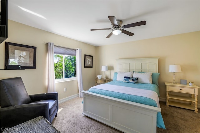 bedroom featuring ceiling fan and carpet