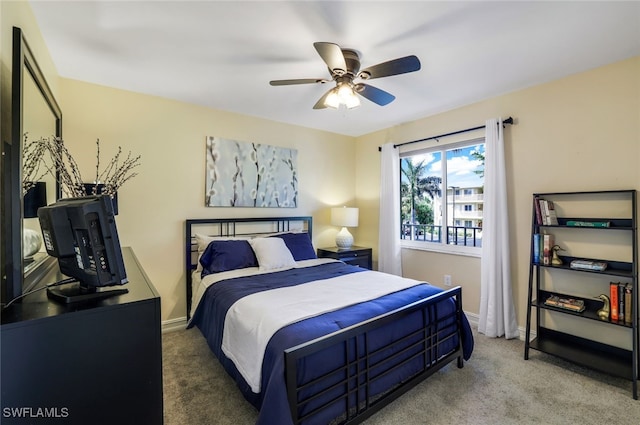 bedroom featuring ceiling fan and carpet flooring