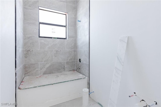 bathroom with tiled shower