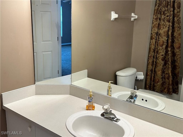 bathroom with vanity and toilet