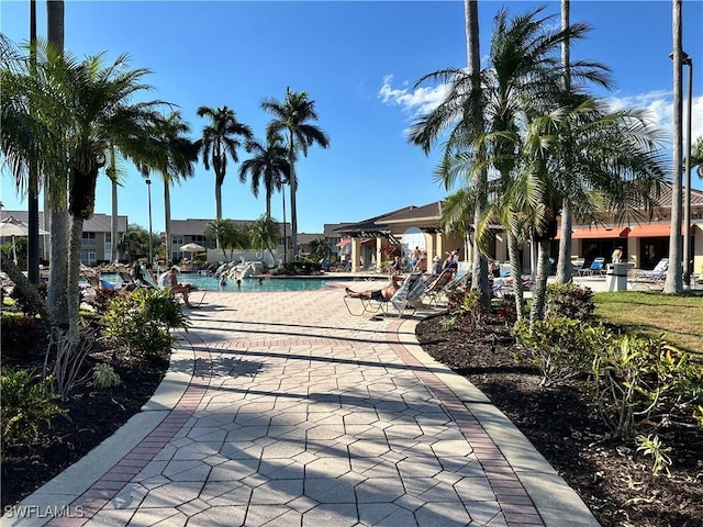 exterior space featuring a swimming pool and a patio area