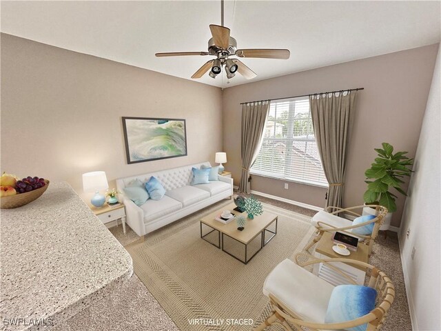 living room with ceiling fan and carpet floors