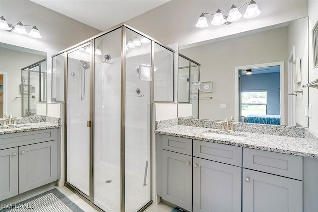 bathroom with vanity and walk in shower