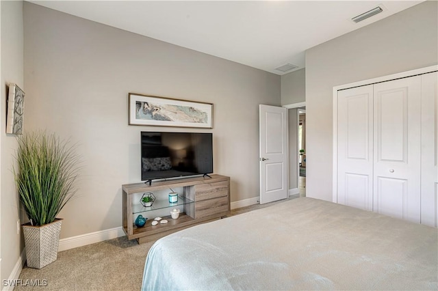 carpeted bedroom with a closet