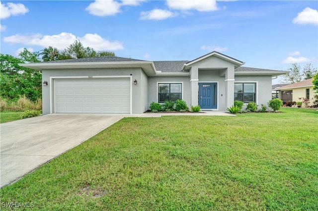 view of front of house with a garage and a front lawn