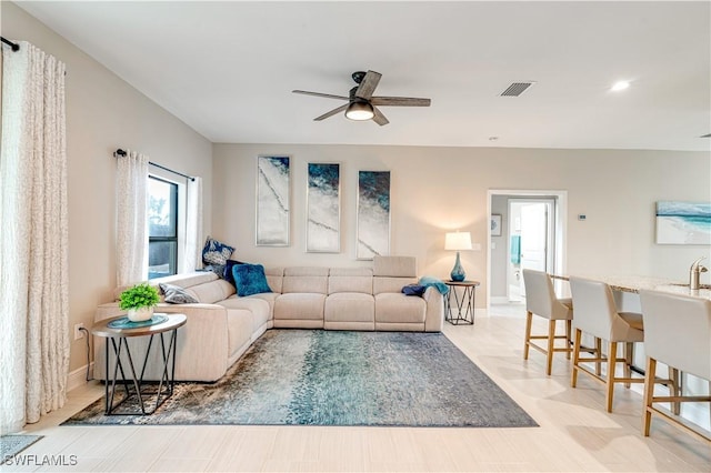 living room featuring ceiling fan