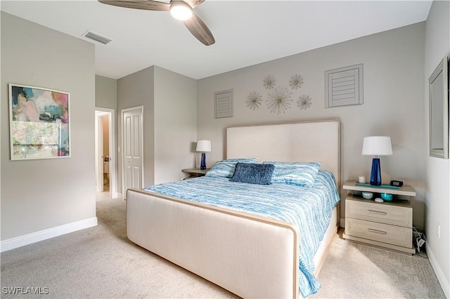 bedroom with ceiling fan and light colored carpet