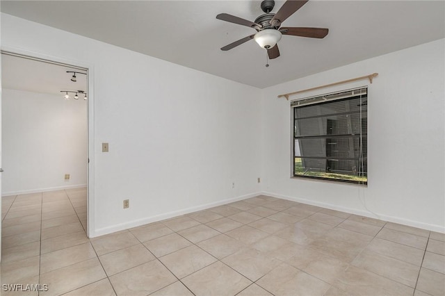 unfurnished room with light tile patterned floors and ceiling fan