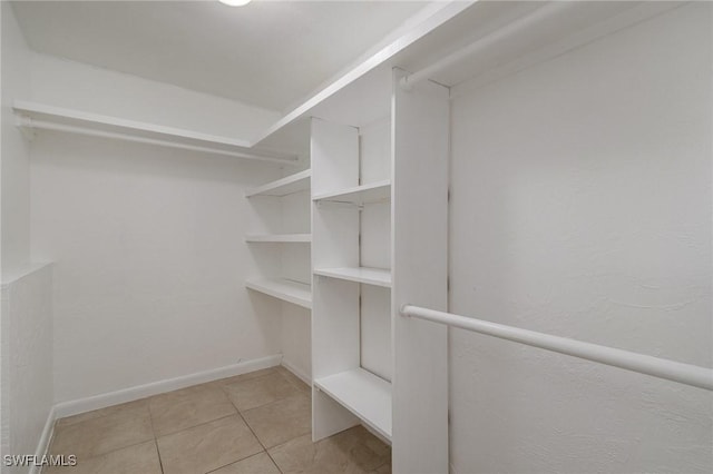 walk in closet featuring light tile patterned floors