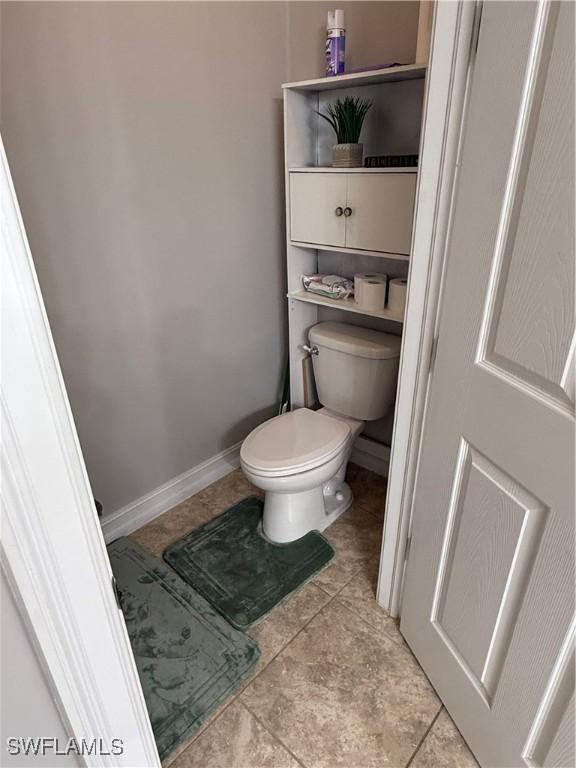 bathroom with tile patterned floors and toilet