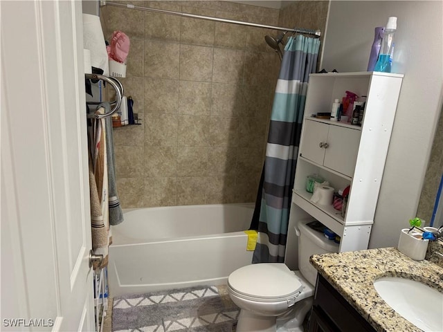 full bathroom with shower / tub combo with curtain, vanity, and toilet