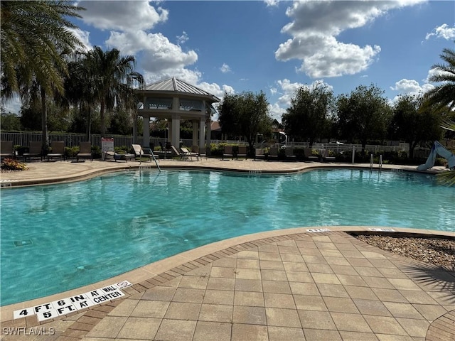 view of pool featuring a gazebo and a patio