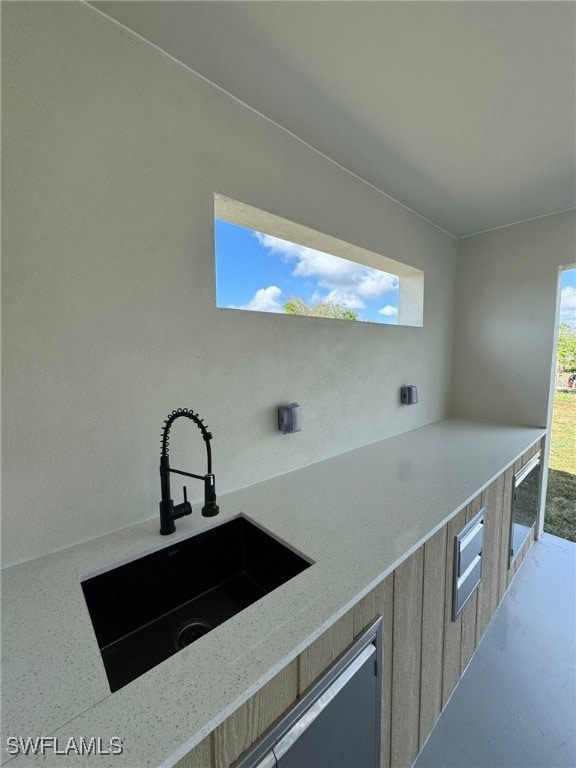 view of patio / terrace with sink and wine cooler