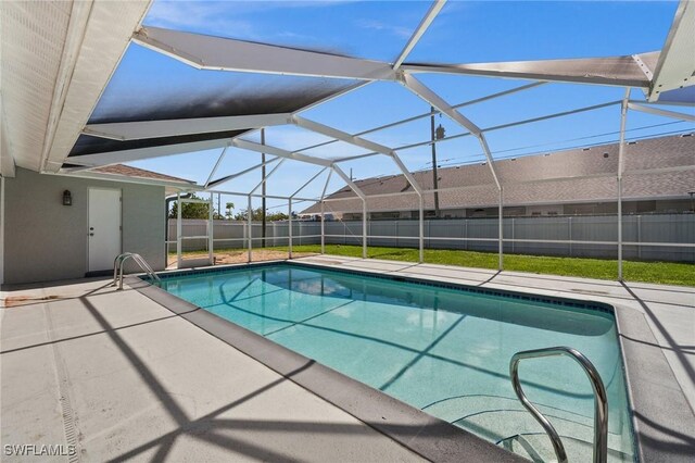 view of pool featuring fence, a fenced in pool, and a patio area