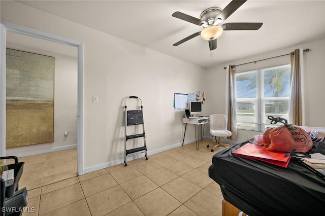 living area featuring ceiling fan and light tile patterned floors