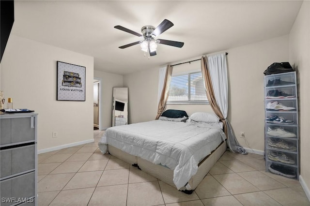 bedroom featuring light tile patterned flooring and ceiling fan