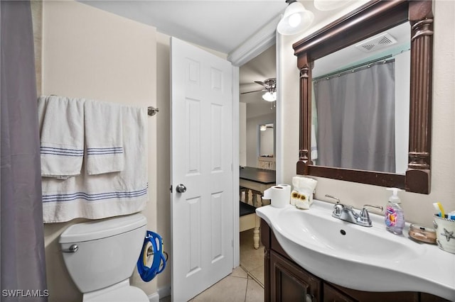 bathroom with toilet, tile patterned flooring, a shower with shower curtain, and vanity