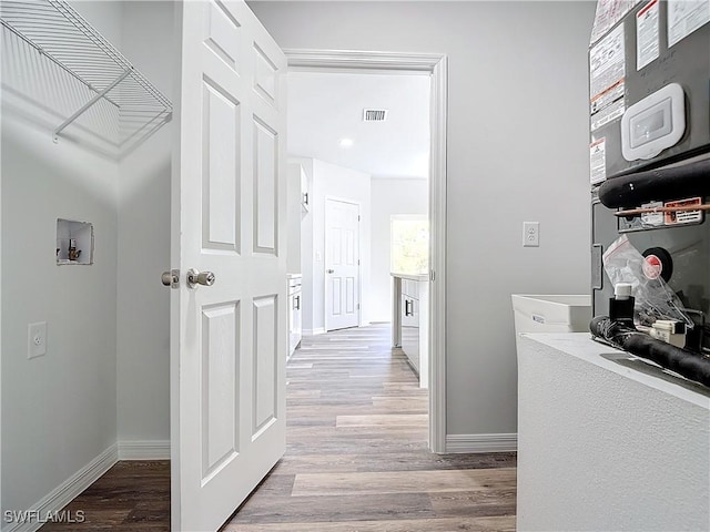 hallway with light wood-type flooring