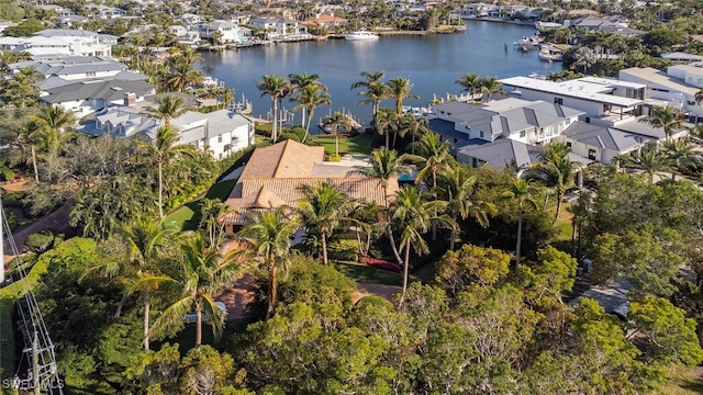 birds eye view of property featuring a water view and a residential view